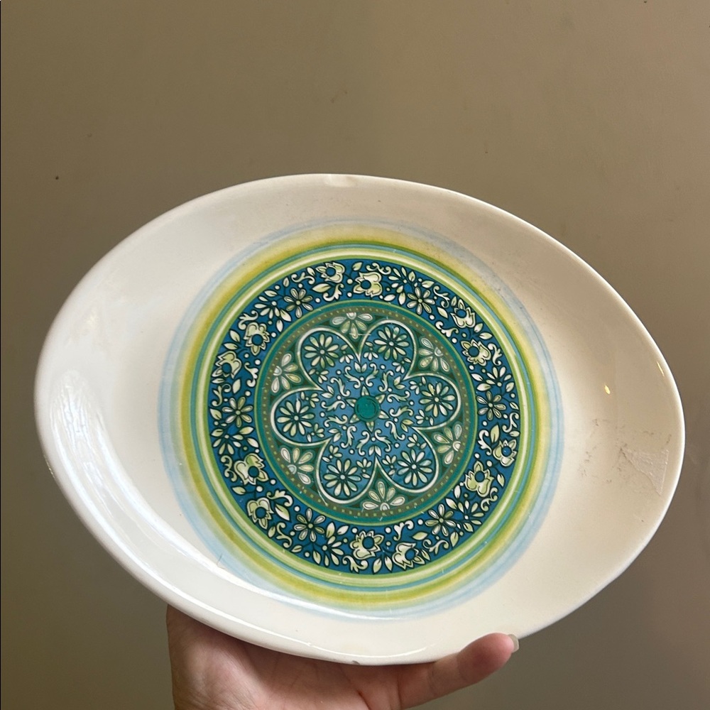 Mid-century modern floral medallion pattern platter with blue, teal/green hues.